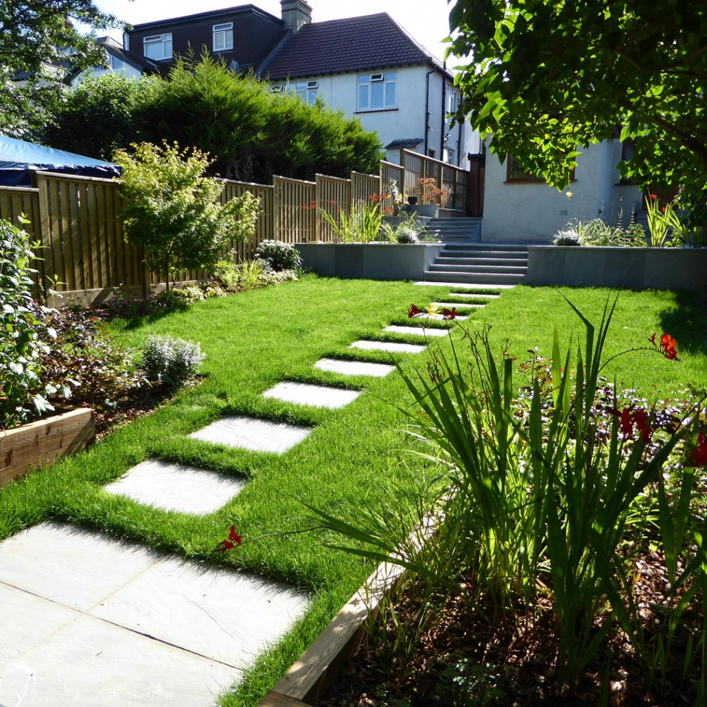 A stepping stone path was laid through the lawn to the rear, with steps leading from a raised terrace for entertaining.