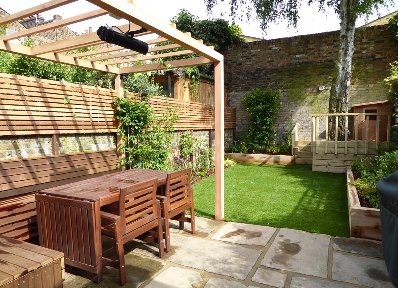 This Finsbury garden design in Islington, London N1, features a bespoke play den, pergola and seating area.