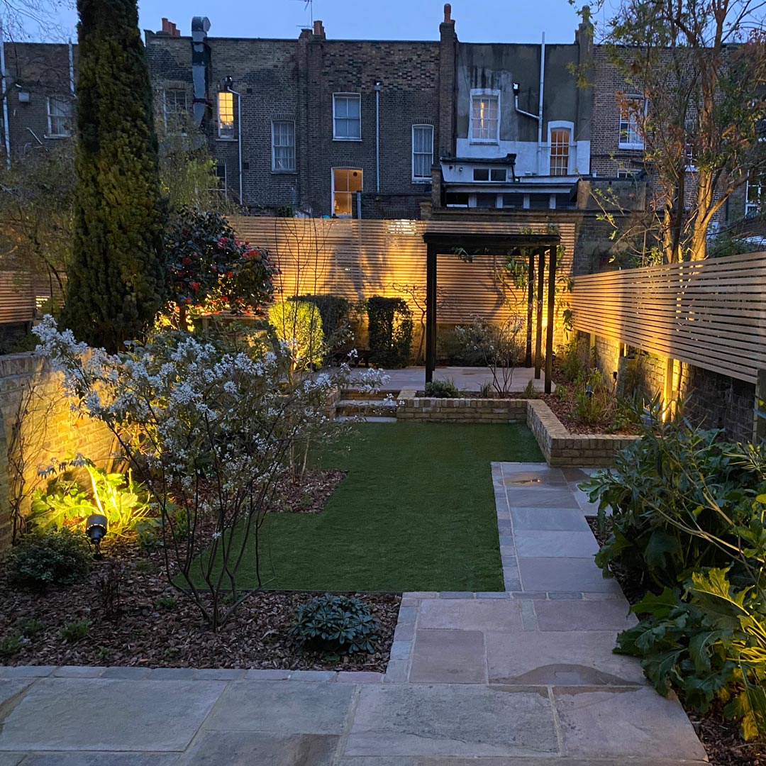 The lighting design softly highlights the key areas of the garden to be enjoyed at night.