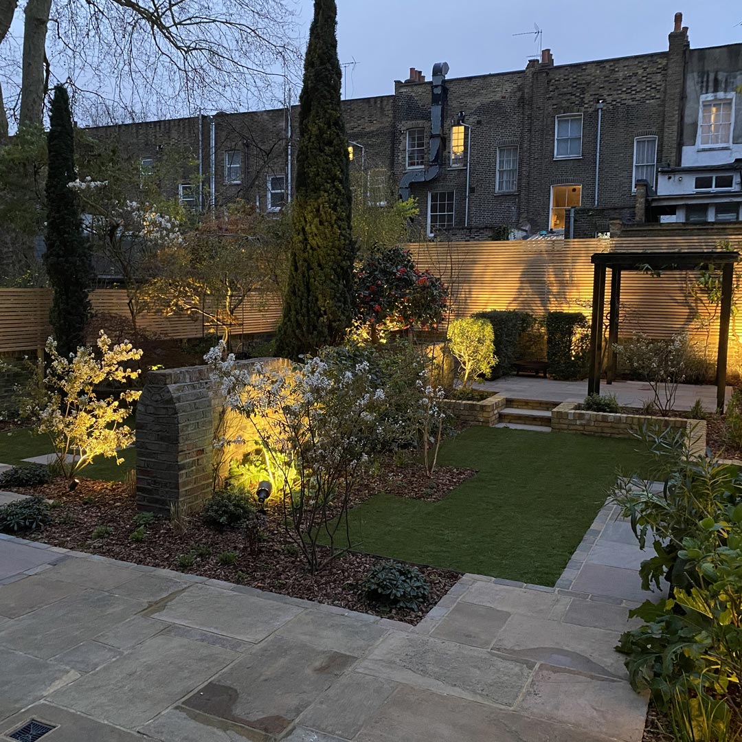 The statuesque presence of the Italian Cypressus semperviren trees encourage you to look up, adding a new dimension to this garden design.