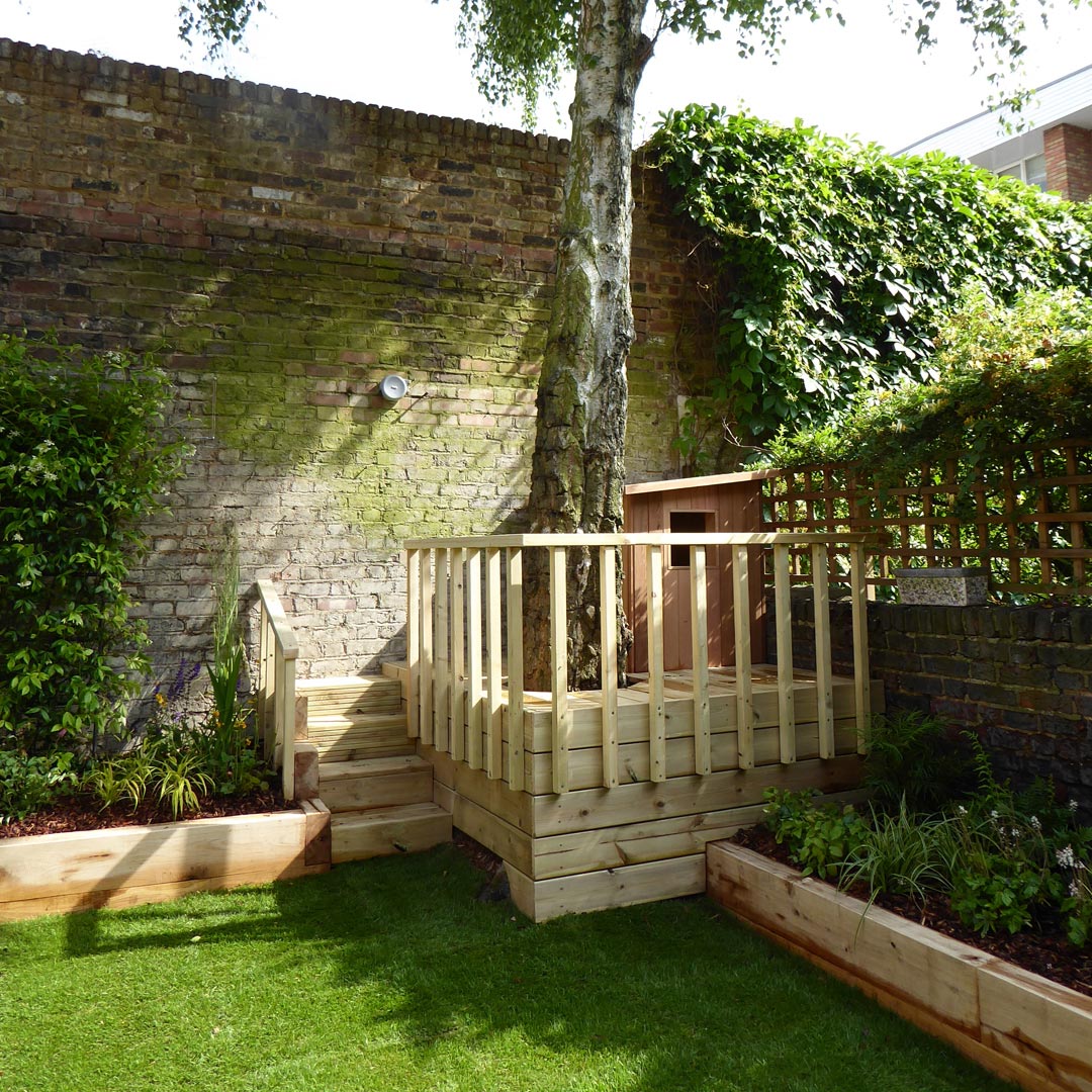 The Birch tree dominating the garden is grounded by the play area beneath.