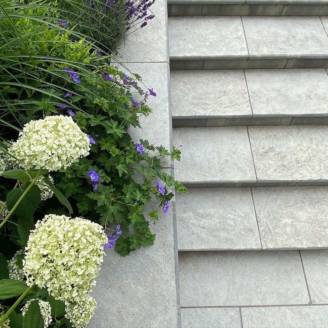 Detail of the Grey limestone steps leading down from the terrace.