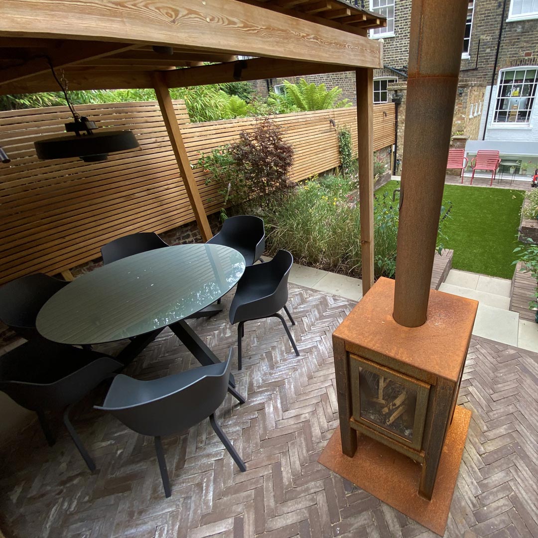 Out door heating and lighting under a covered pergola for all year round gatherings.