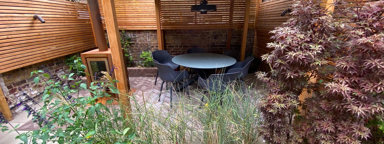 A garden design for a Georgian property in Islington, London N1, designed for outdoor cooking & children's play.