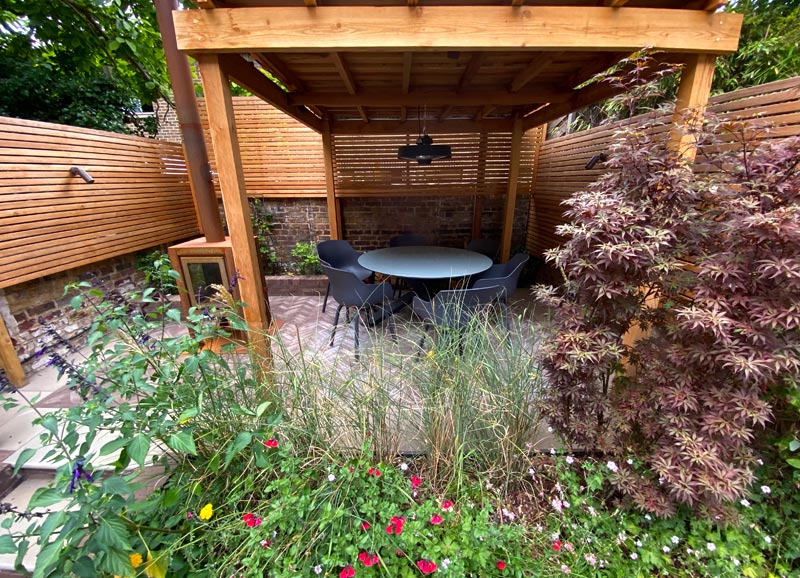 A garden design for a Georgian property in Islington, London N1, designed for outdoor cooking & children's play.