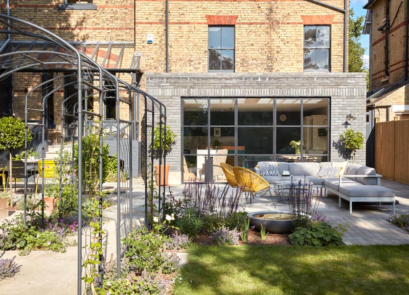 The large rear garden complements the architecture and is divided into zones. Features include a large area to entertain in, various focal points, pleached hedging for privacy, and a rose walk.