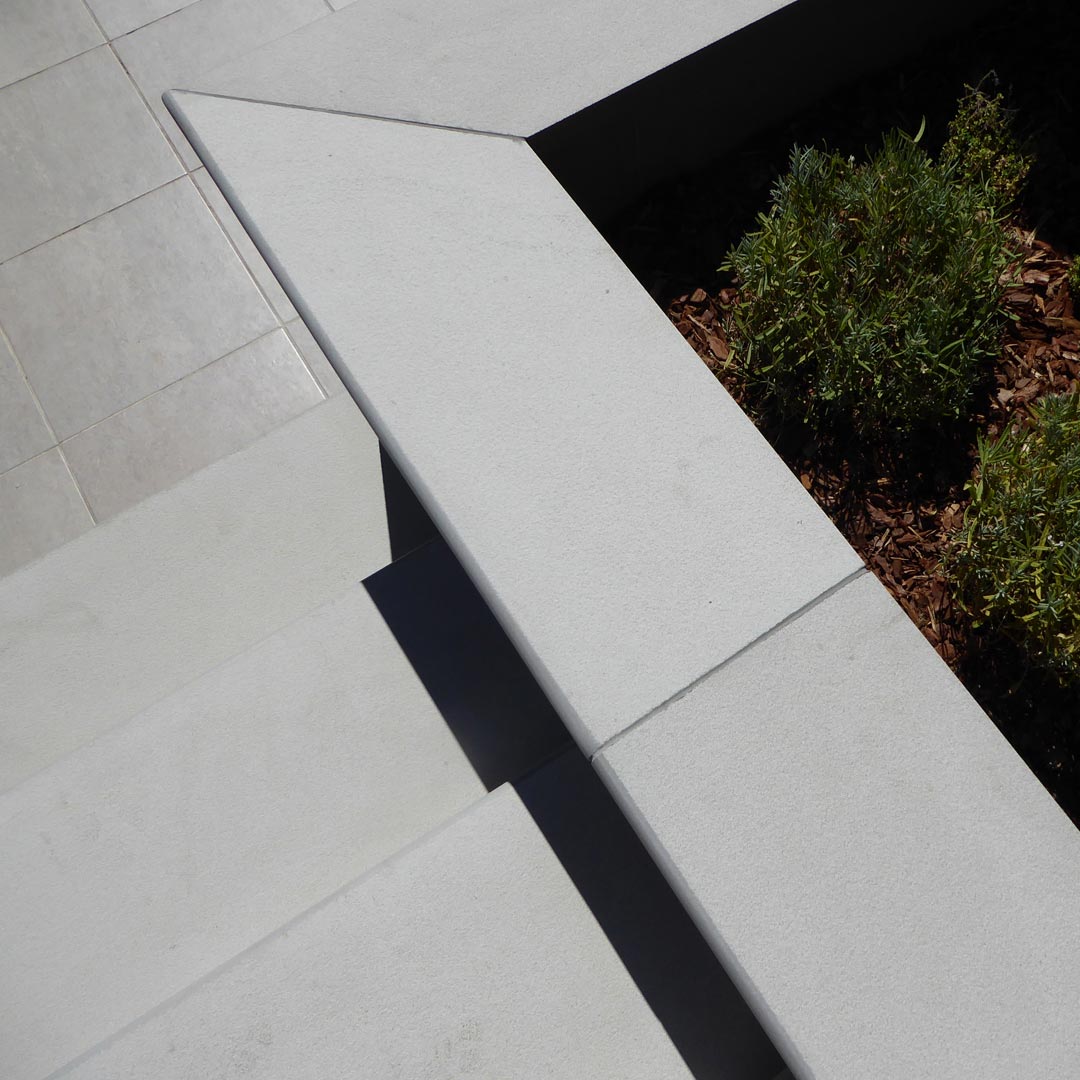 Porcelain bluenosed steps, copings, patio tiles and newly planted Lavandula angustifolia ‘Alba’.