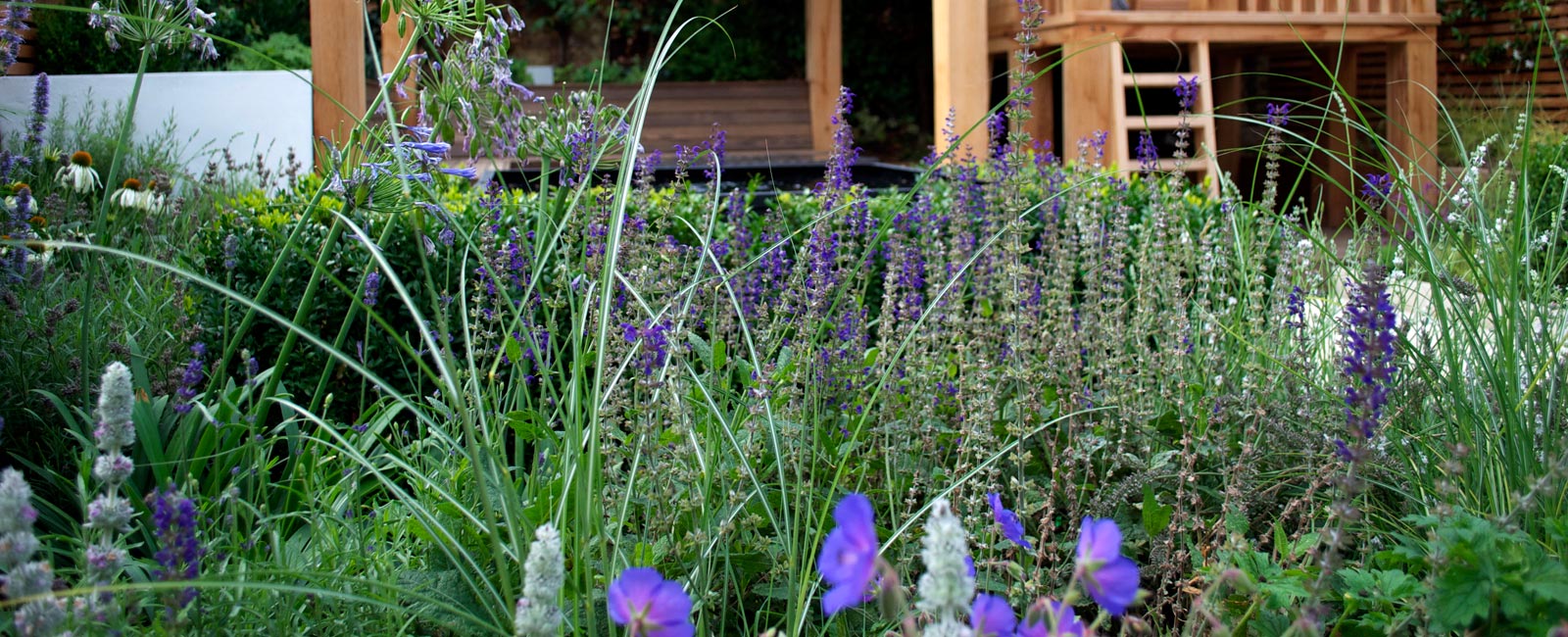 The garden landscaping included low-maintenance Mediterranean planting in cool blue, indigo and purple colours, custom-made outdoor storage cupboards and even a herb area.