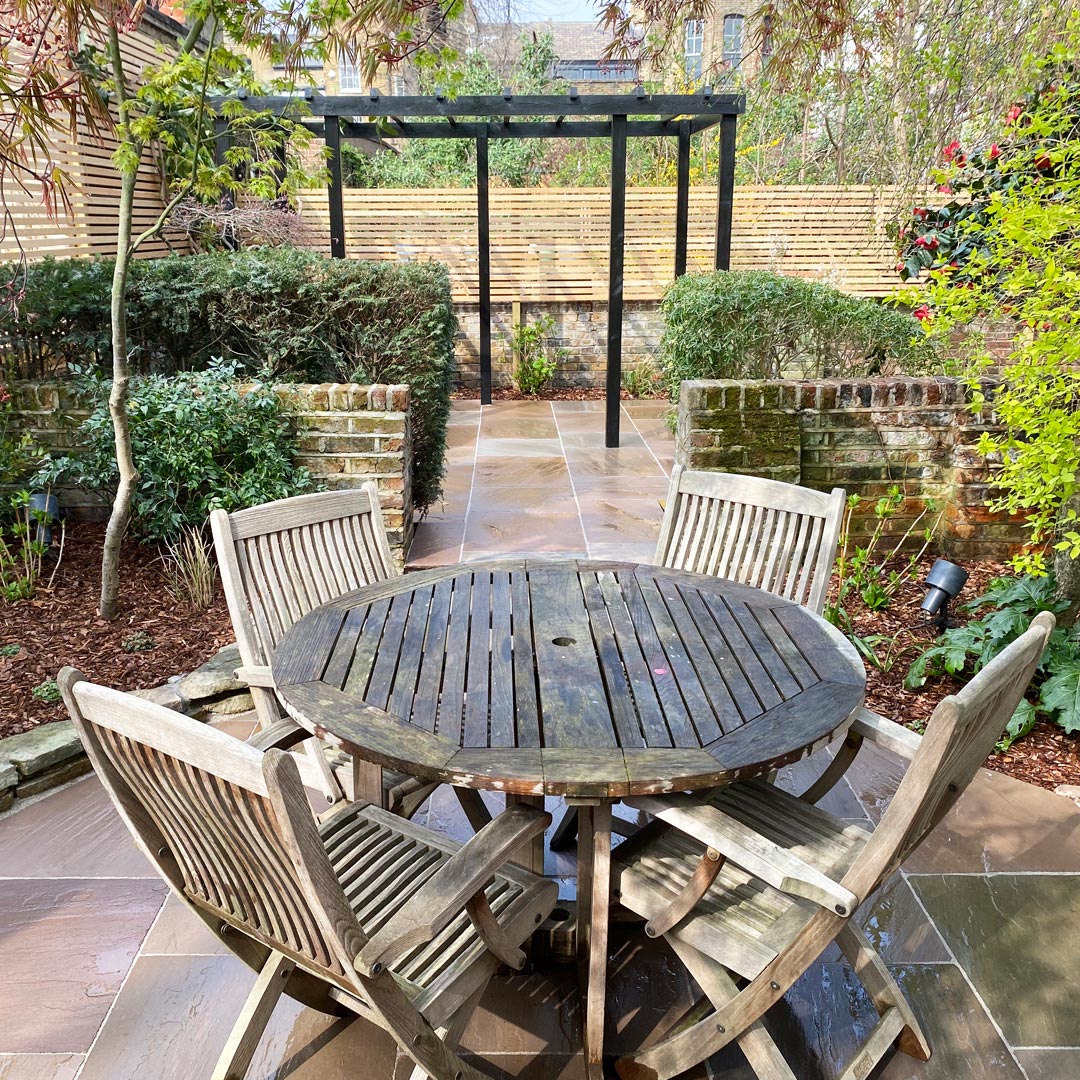 The garden has been carefully divided into zones to create many places to sit and entertain.