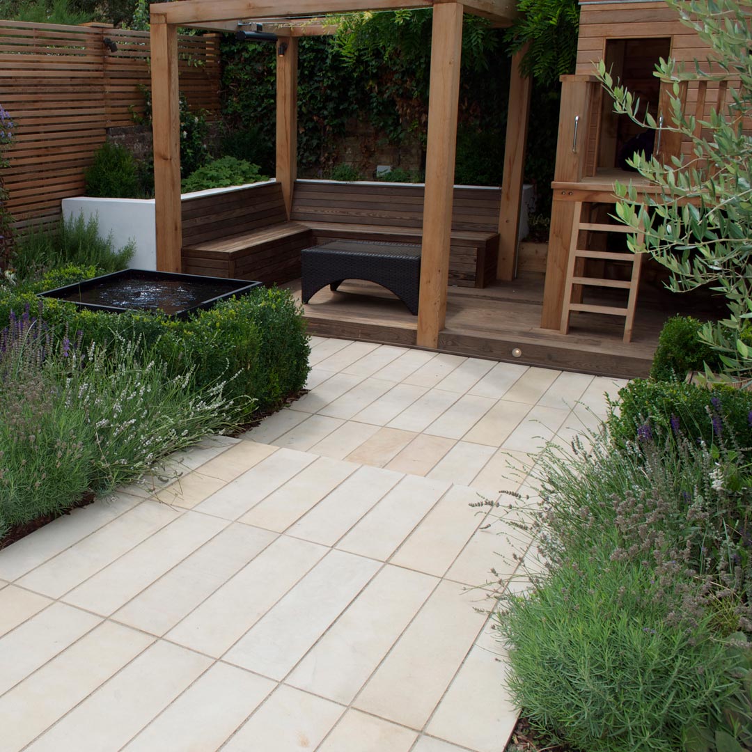 Sandstone plank paving, stepping down into the entertaining area of the garden.
