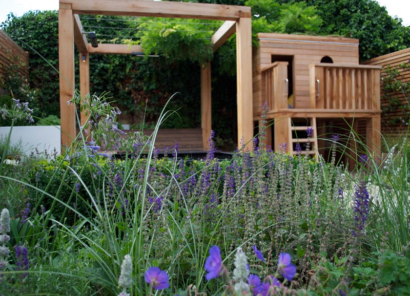 The garden landscaping included low-maintenance Mediterranean planting in cool blue, indigo and purple colours, custom-made outdoor storage cupboards and even a herb area.